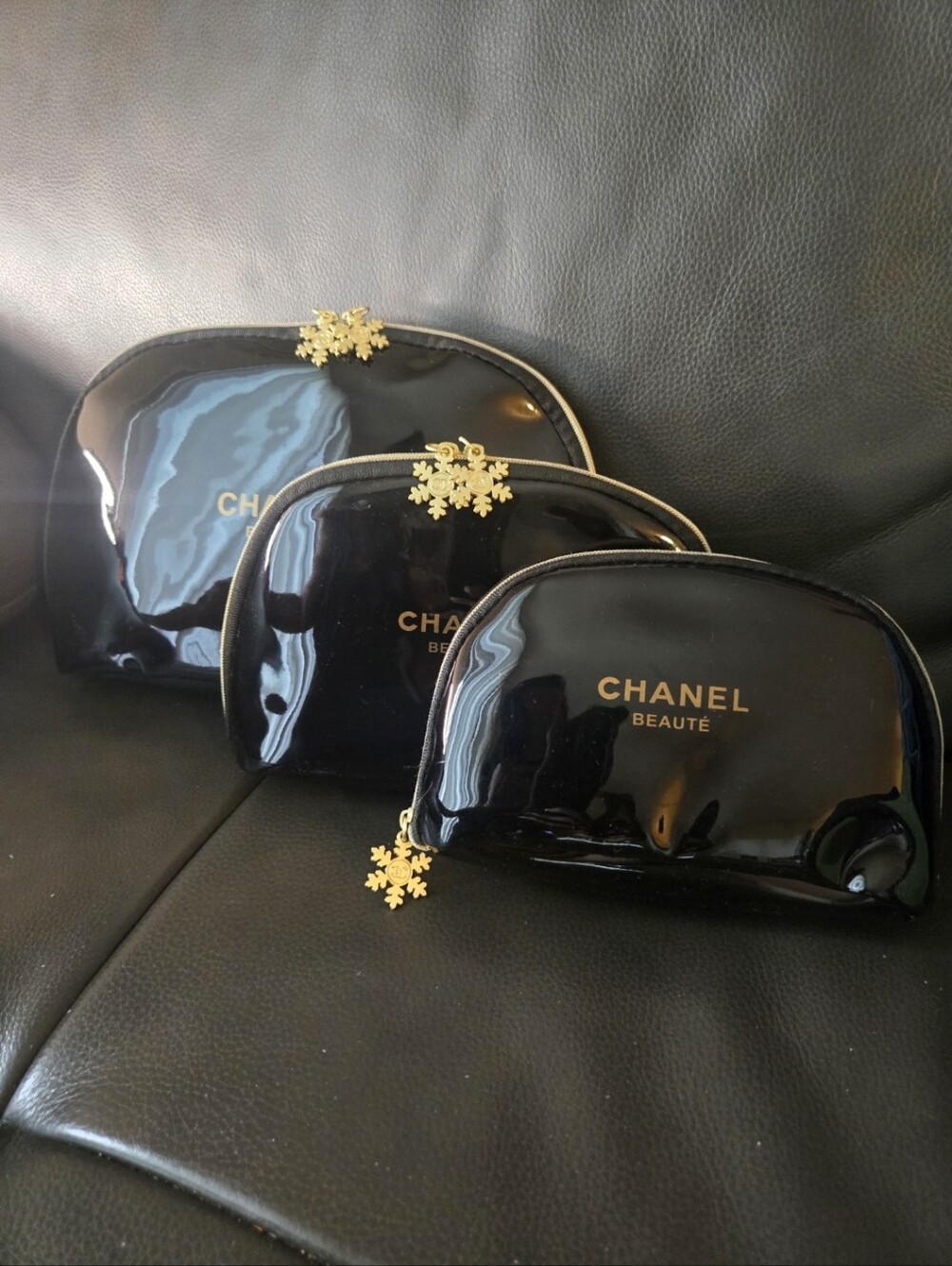 CHANEL Black Patent Cosmetic Pouch Trio with Gold Snowflake Zips